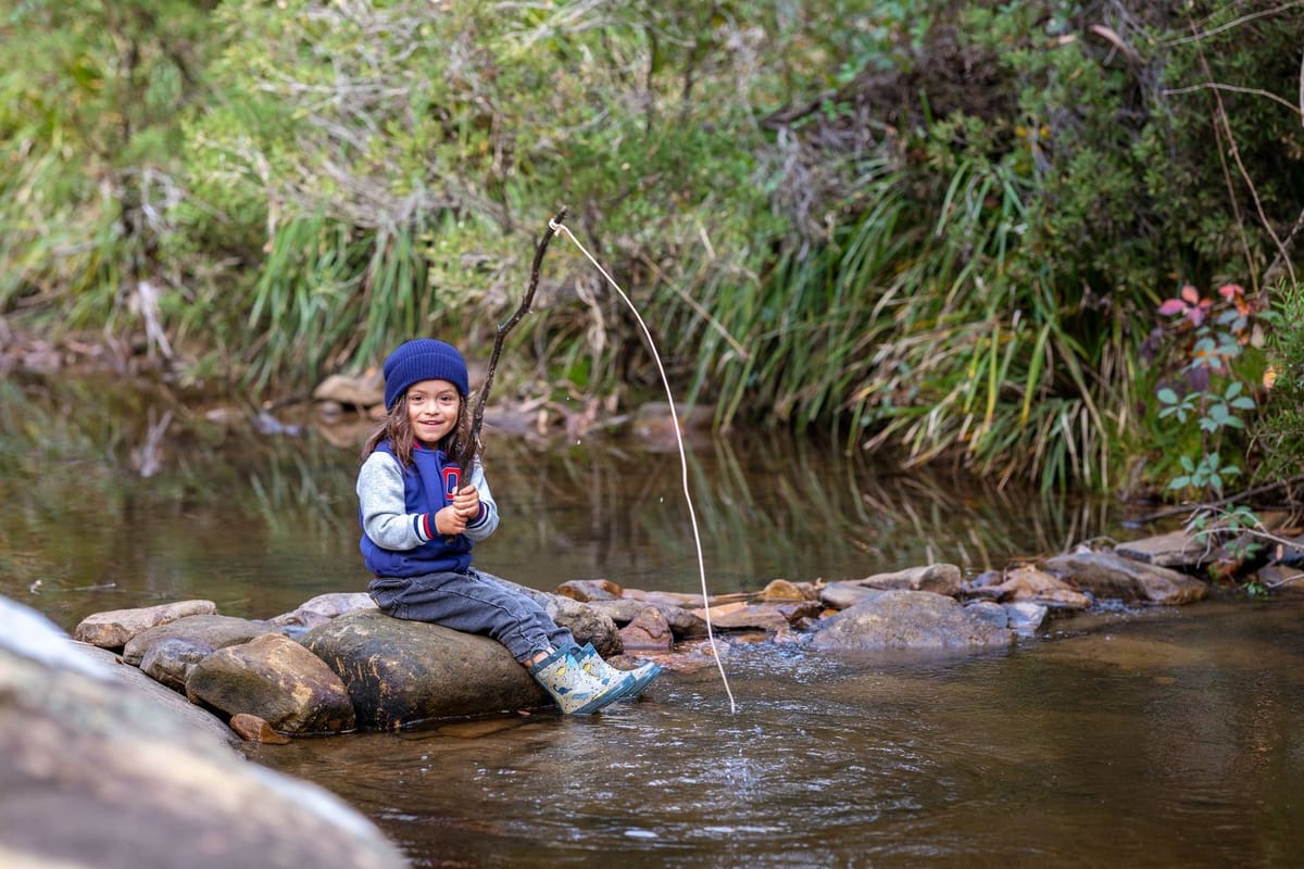 Child stream fishing stick — photographed at Maya Sanctuary, Blue Mountains