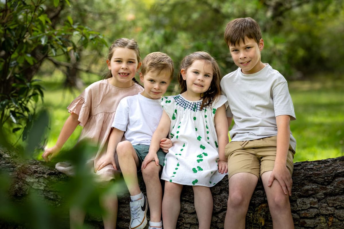 Children on log — photographed at Woodford Reserve, Woodford