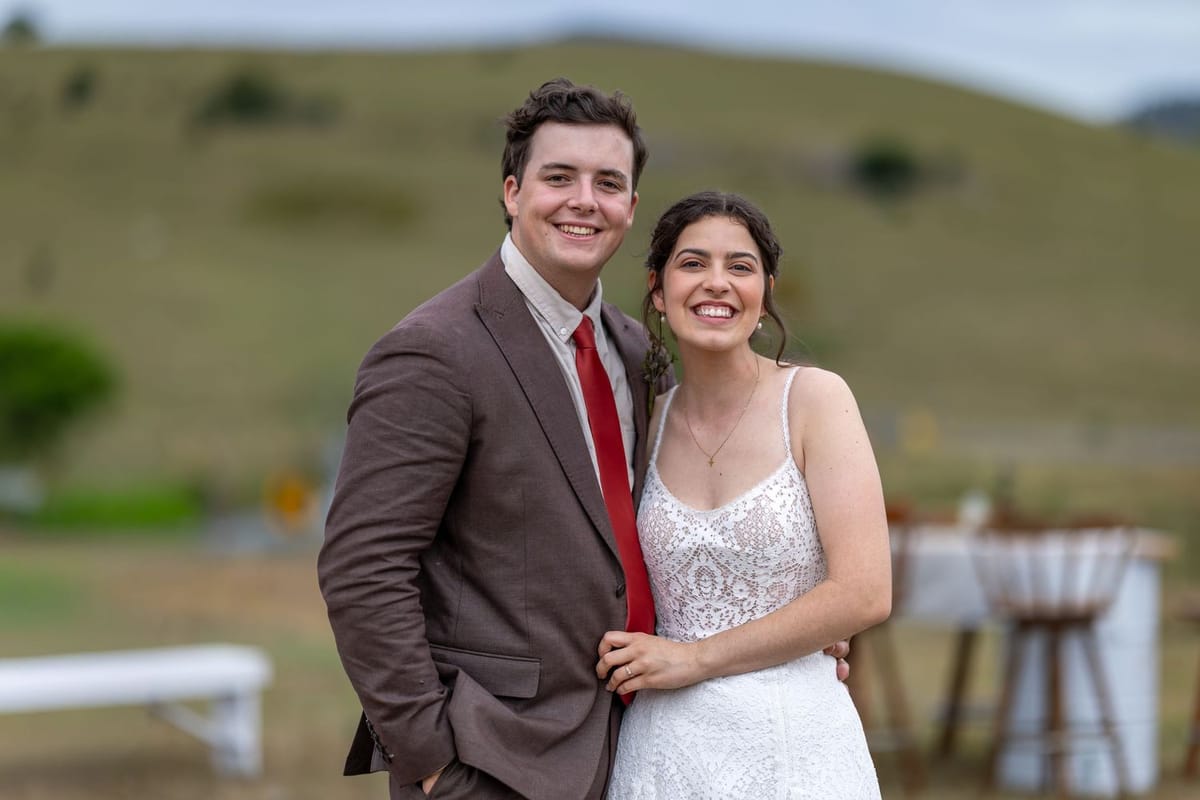 A bride and groom in the hills above Singleton at golden hour