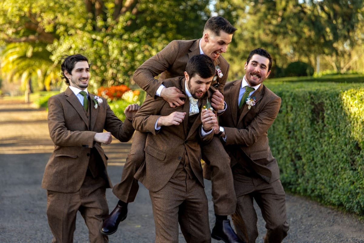 Groomsmen laughing — photographed at Glenleigh Estate, Penrith