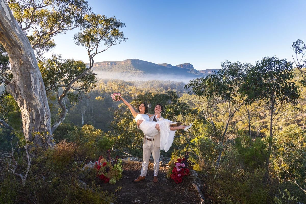 A newly married couple celebrating on the bush track at Maya Sanctuary
